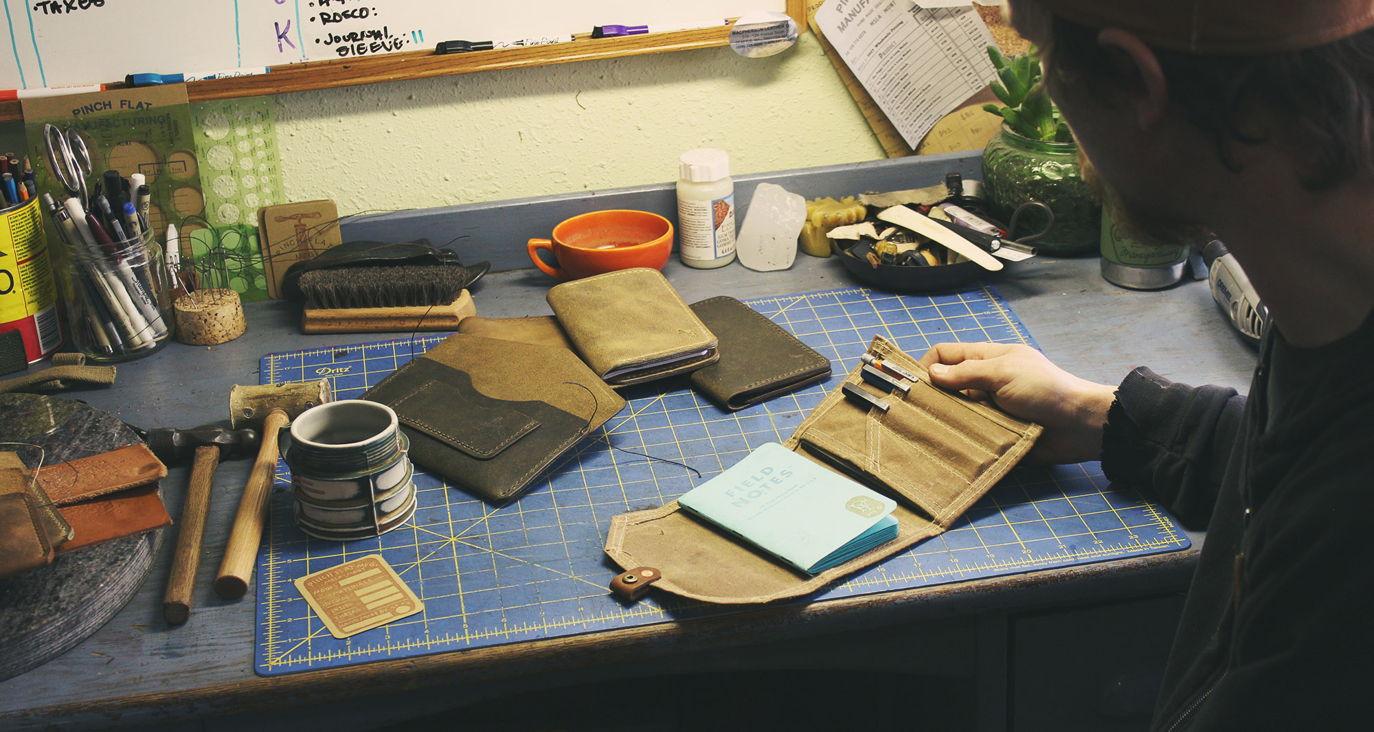 Leather and canvas worker Jeremy Haas at his workbench