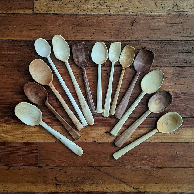 Andy Spoons hand-carved spoons and utensils in a row