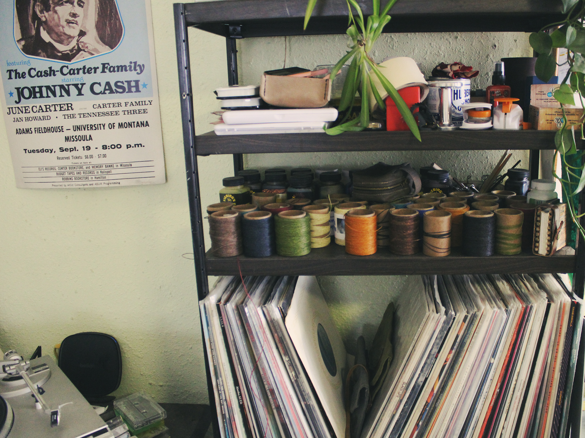 Vinyl records and waxed thread on a shelf