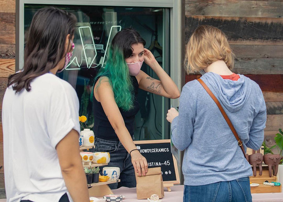 Cristina selling handmade ceramics at Texas pop-up market maker's craft fair